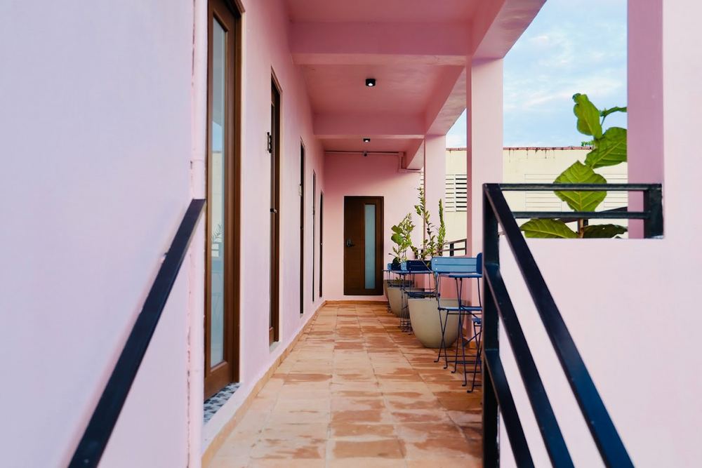 The pink breezeway workspace at Hotel Luz